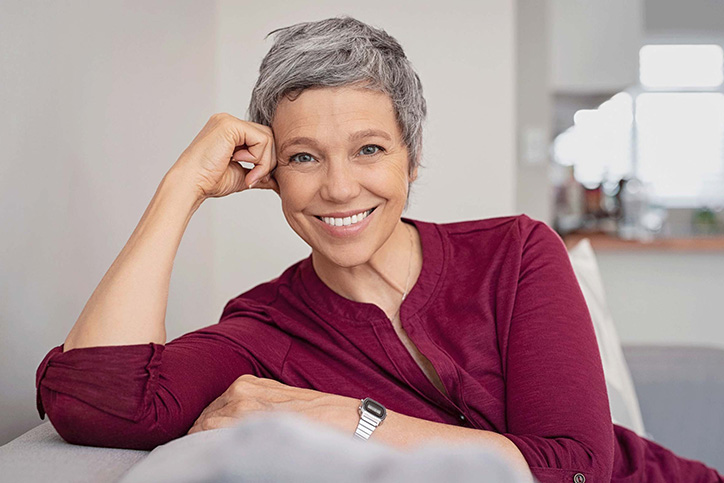 woman smiling on a couch